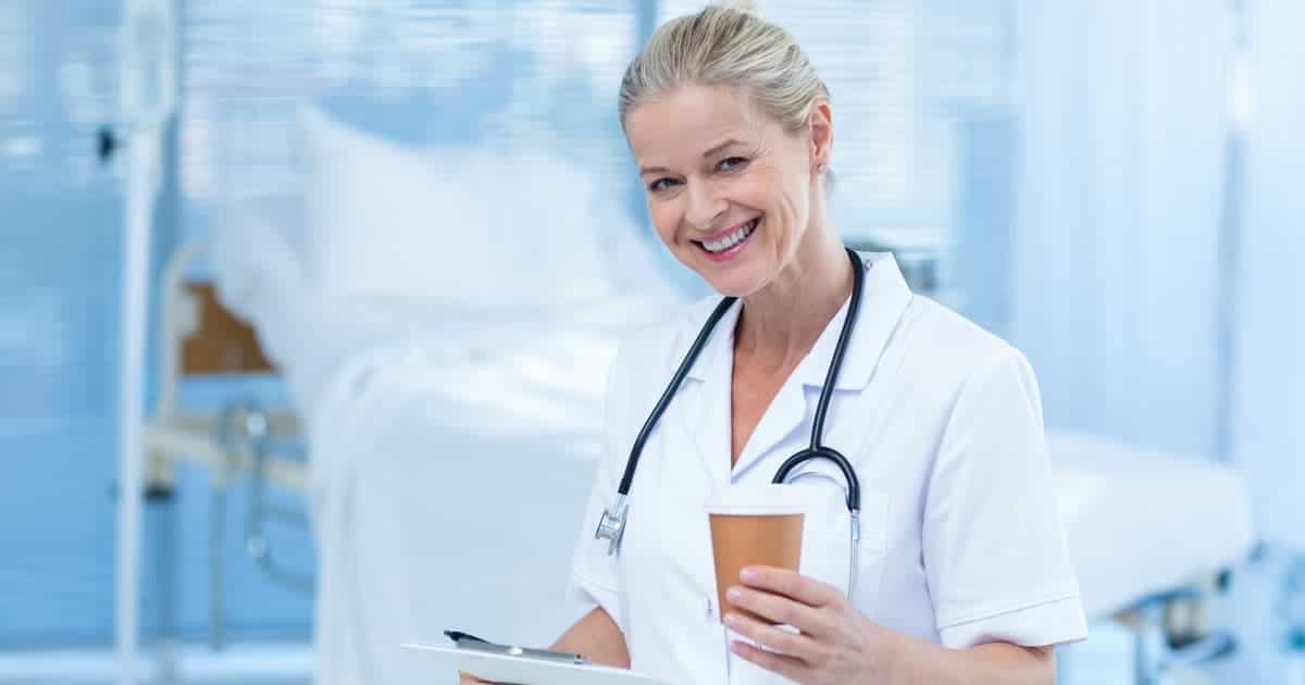 nurse holding cup